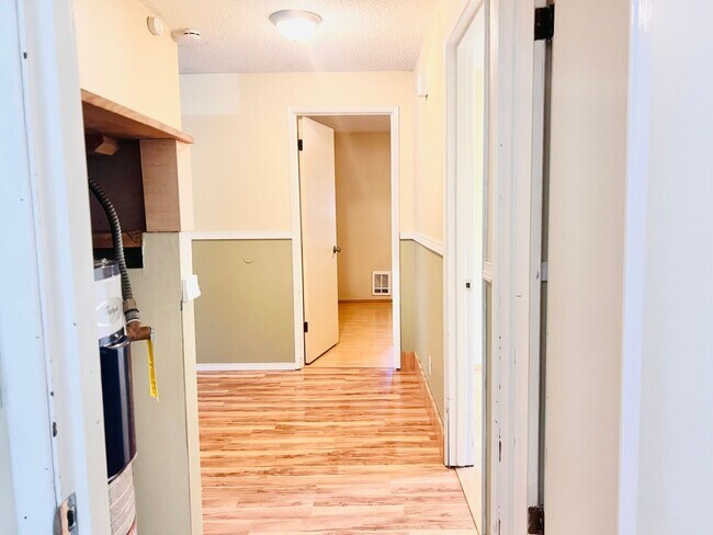 Building Photo - Charming 3BR/1BA w/ 1-car garage, long driveway, fenced yard, wood stove & shed/workshop.