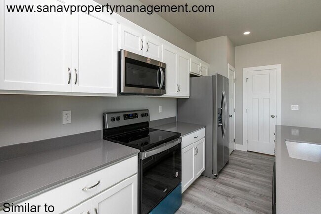Building Photo - Stunning 4-Bedroom Home with Finished Base...