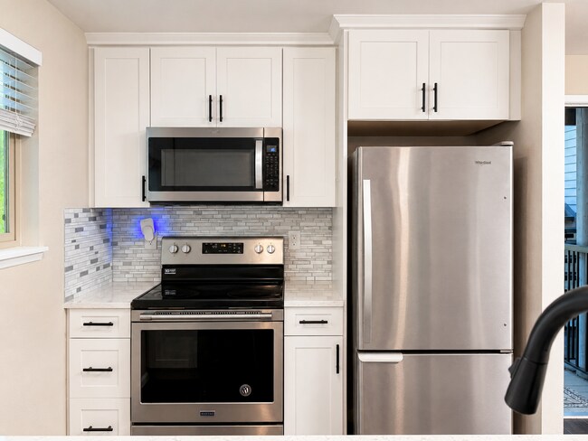 Building Photo - Modern Wooded Condo with Upgraded Kitchen & Private Deck