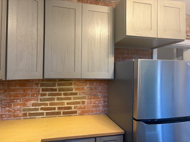 New Refrigerator with Ice Maker and exposed Brick - 222 W Union St