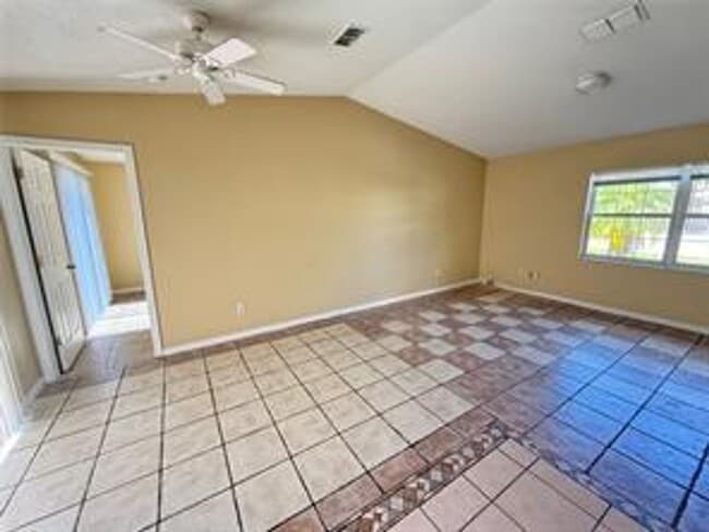 Building Photo - Charming 3-bed, 2-bath POOL home with 2-car garage. Features ceramic tile flooring, updated kitch...
