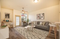 Fairview Village | Spacious Living Room with Ceiling Fan and Access to Eat In Breakfast Bar - Fairview Village Apartments