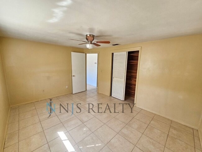 Building Photo - JUST REDUCED!!! True 2/1.5/1 with FIREPLACE, fenced yard and all tile flooring throughout!