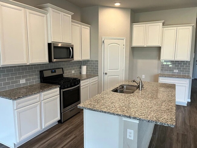 Building Photo - Four bedroom home with dedicated home office, game room, 2.5 bathrooms, and fenced yard in Fairwa...