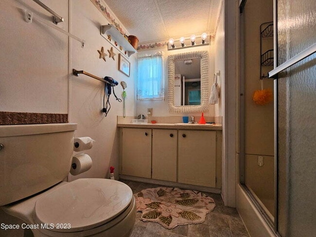 Building Photo - 55+ in Quiet Gated Community