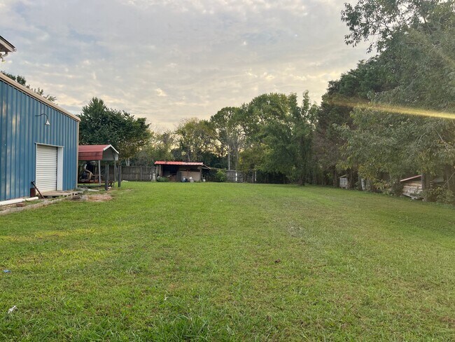 View of backyard, partially fenced - 3424 Watts Ln