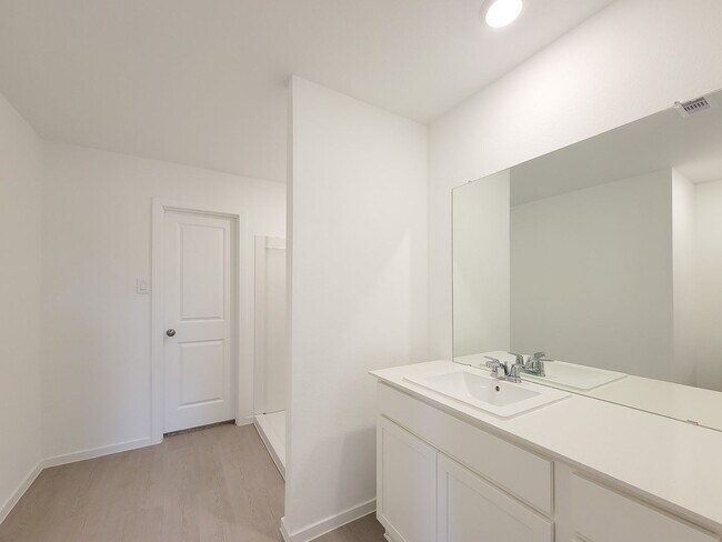 Building Photo - This great new single-story design makes smart use of the space available. At the front are all t...