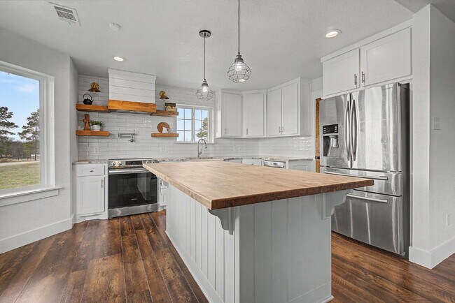 Building Photo - “4-Bedroom, 3-Bath Farmhouse Charm Meets Modern Luxury on a Serene 5-Acre Lot!”