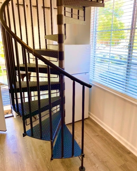 Spiral staircase to bedroom and bathroom upstairs - 372 Chaucer Dr