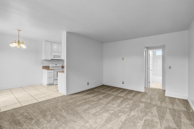 Building Photo - Upstairs 1 Bedroom Condo w/ Parking - Fresh Paint & Carpet!