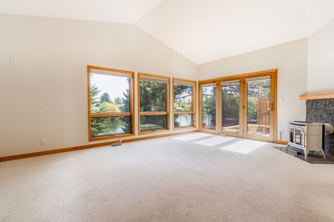 Building Photo - Private river access and stunning views from this home on Harmon Blvd! + Bonus Room