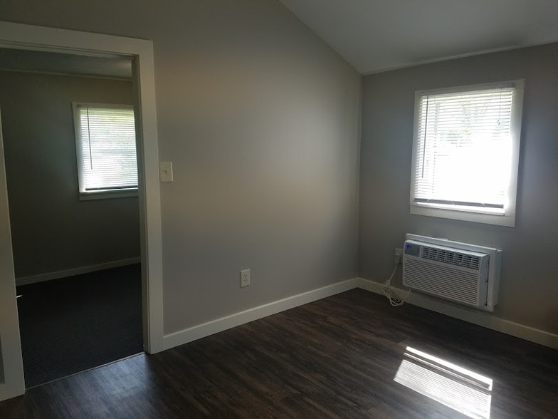 Living room looking into bedroom - 103 12th W St