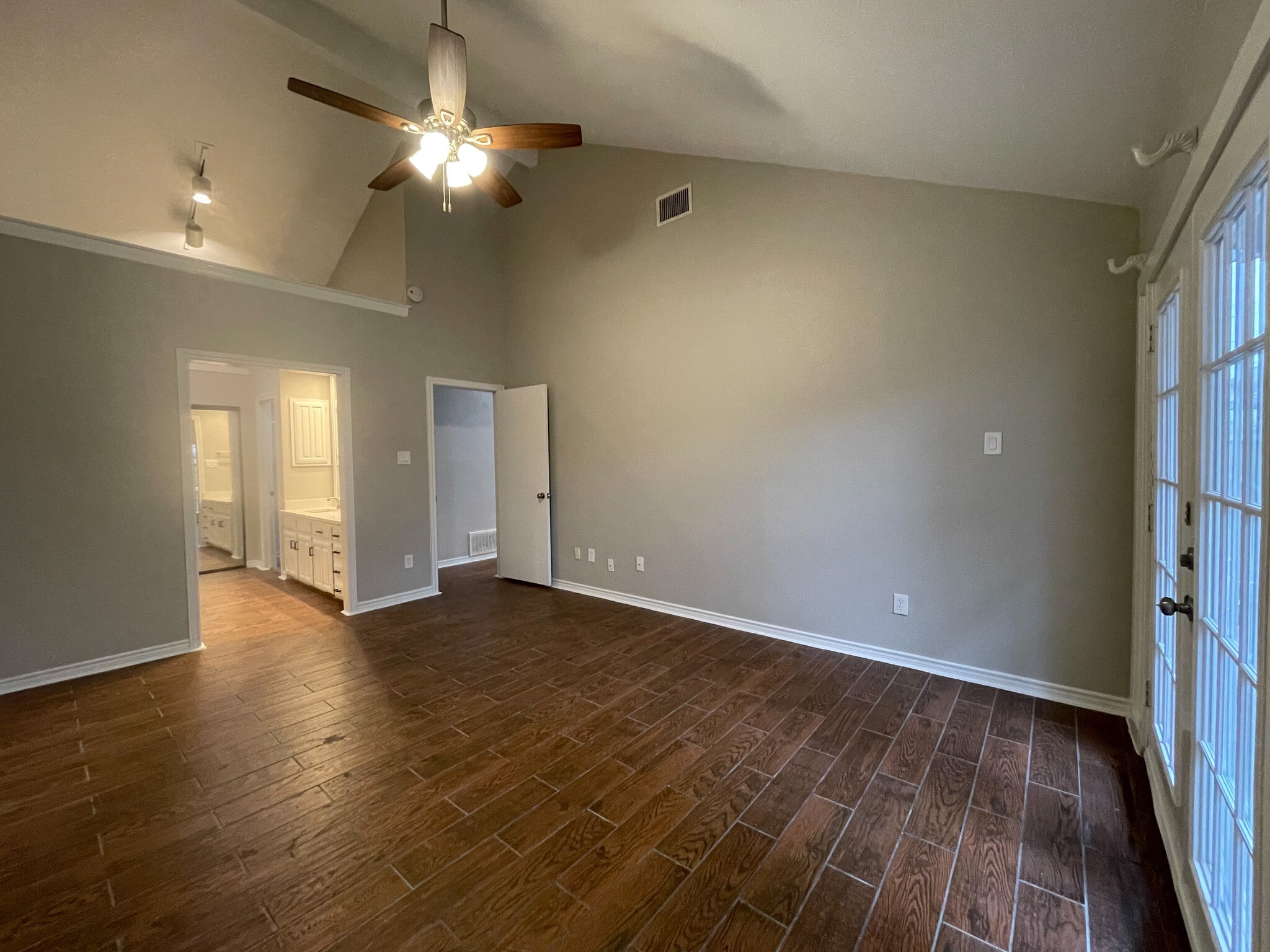 Master bedroom features vaulted ceiling, new ceiling fan and French doors that lead out to separate patio space. - 812 Via Madonna
