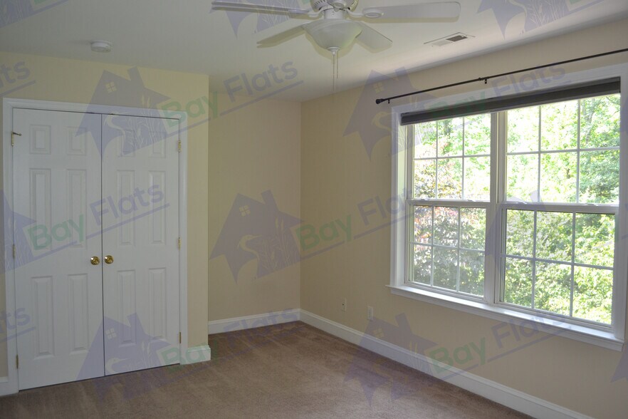 Bedroom at rear of house with closet. - 41195 Friendship Ct