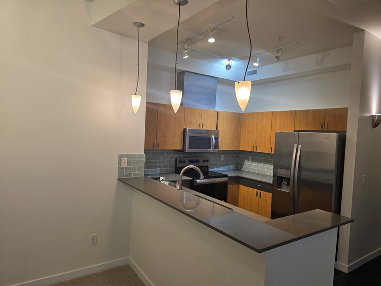 Kitchen with new stainless steel appliances - 521 7th Ave