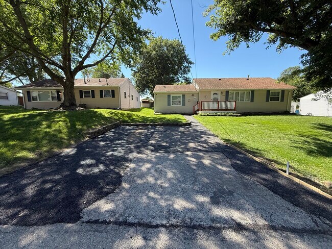 Front of house with newly reasphalt and expanded driveway - 1444 Dodge St