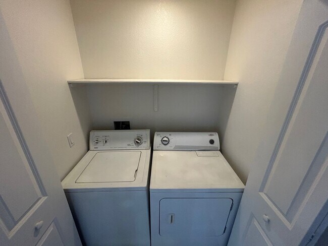 Building Photo - INVITING 2 BEDROOM TOP FLOOR CONDO IN A CE...