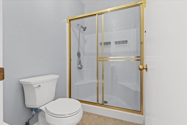 Building Photo - Sleek 2 Bedroom Condo with 2 Car Garage Ne...