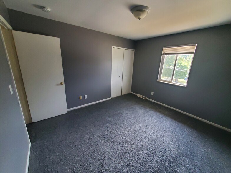 Large upstairs bedroom with huge walk in closet - 5906 Christie Ave SE