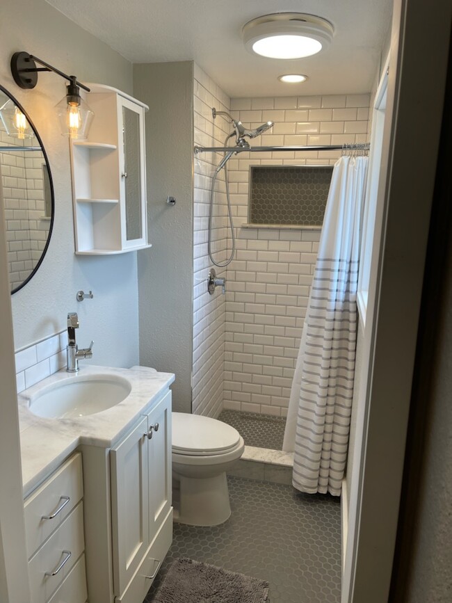 Brand new primary bathroom with heated floors and marble - 20229 125th Plz SE