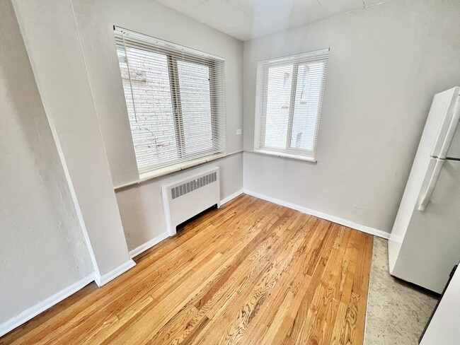 Enjoy natural light in this cozy corner, ideal for a small dining area. - The Birney Apartments