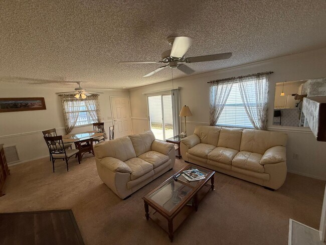 Building Photo - Delightful Unfurnished, 2 bed, 2 Bath Patio Villa available for ANNUAL LEASE