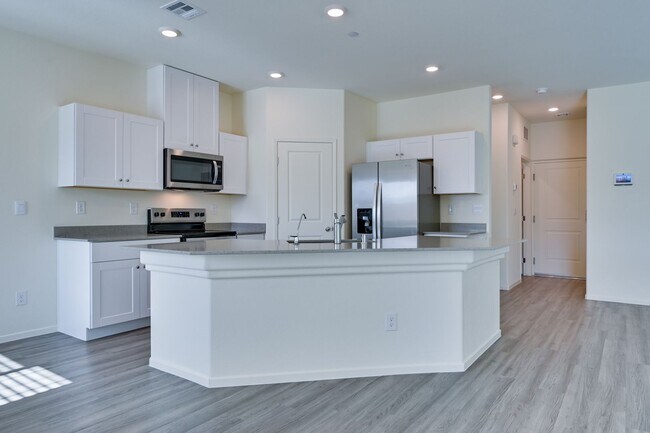 Building Photo - NW 3 Bedroom Townhouse!! Gated Community Pool!! 2 Car Garage!!! No Carpet downstairs.