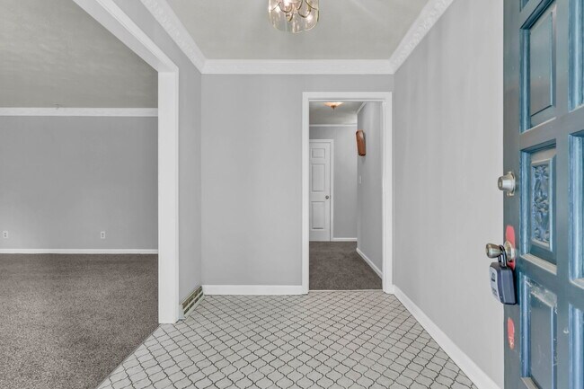 Building Photo - spacious 4-bedroom, 2.5-bath home featuring a 2-car garage and fresh updates throughout.