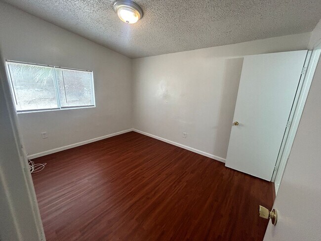 Building Photo - Single story home with large backyard and huge carport with plenty of storage.