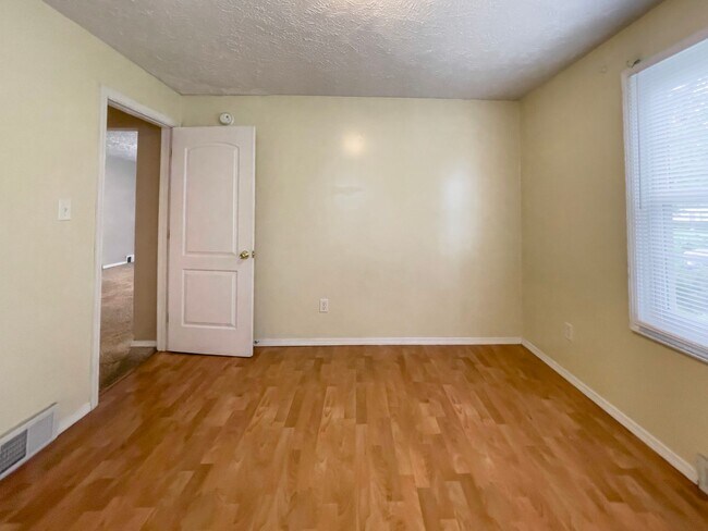 Building Photo - PRELEASING for AUGUST! Walk to Ball State! Bright 4BR Home with Fireplace