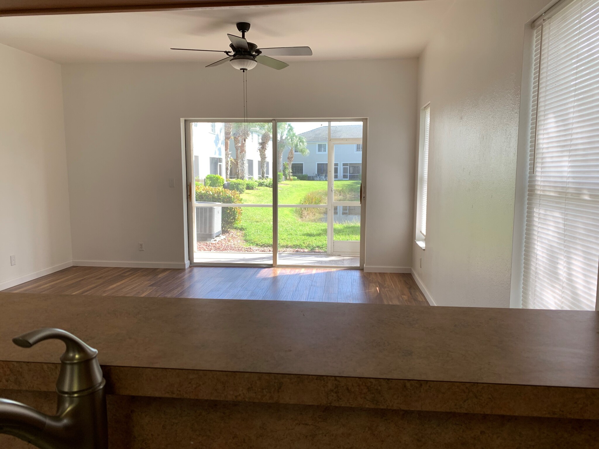 Large dining/living area with new laminate wood flooring! - 10041 Poppy Hill Dr