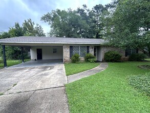 Building Photo - Corner lot in Southern Hills... Lawn included with rent.