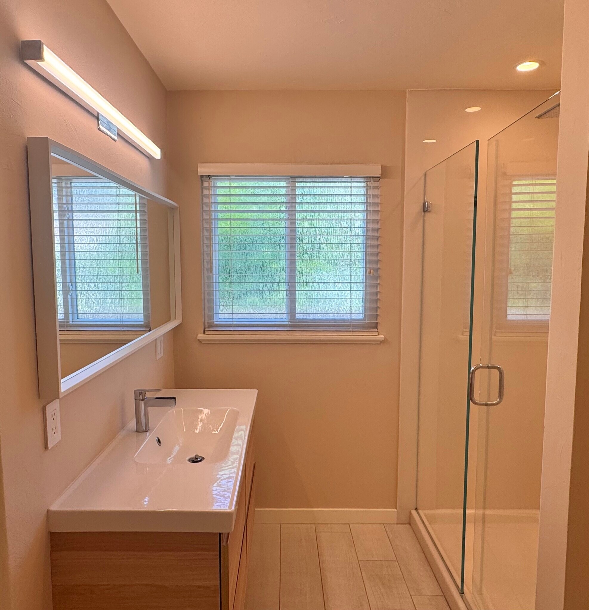 The bathroom is directly across the hall from the primary bedroom. It features a stylish pocket door - 2403 Mira Vista Dr