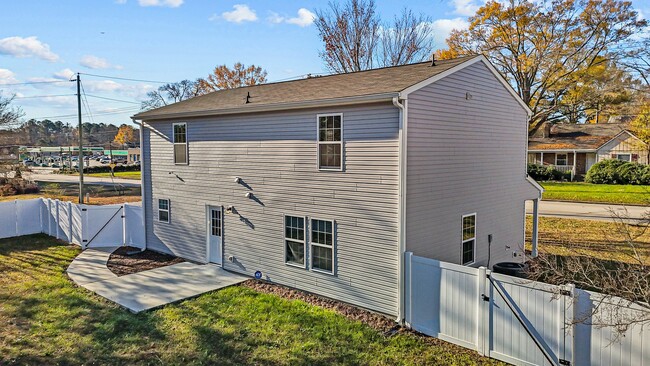 View of backyard; small shed included on property - 105 E Carolina Ave