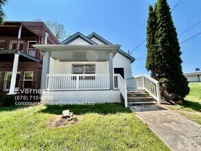 Building Photo - Spacious 4-Bedroom Home with Front Porch a...