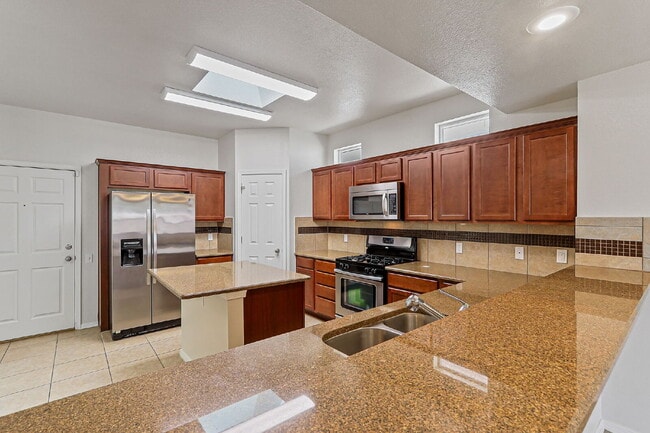 Building Photo - "Spacious 4-Bed Oasis with Granite Touches...