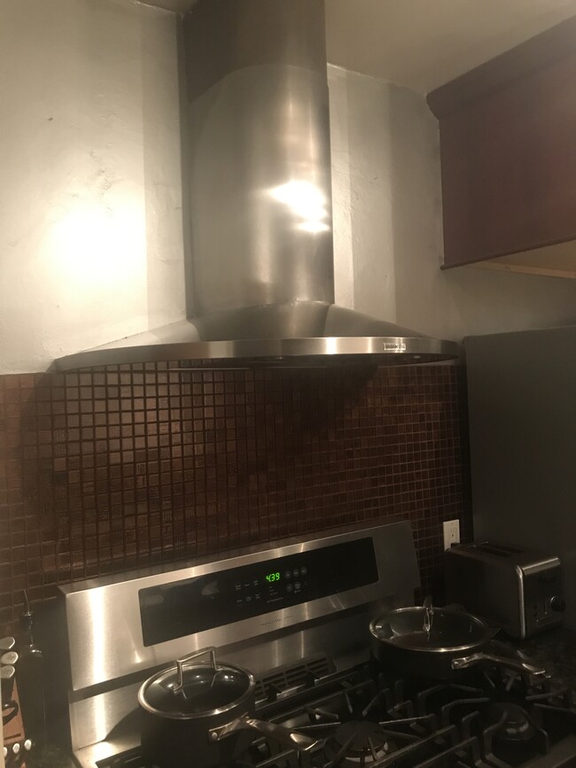 Impressive stainless steel vent fan and hood. - 1857 Pandora Ave