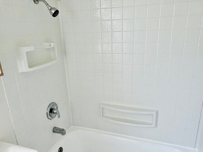 Building Photo - Crisp Duplex, offstreet parking, great backyard too.