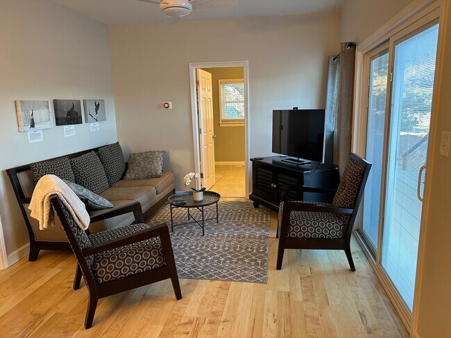 Living room with sliding glass doors to sun deck - 4804 Friends School Rd