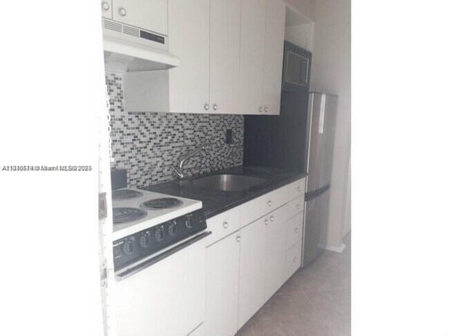 Building Photo - 9920 Collins Ave