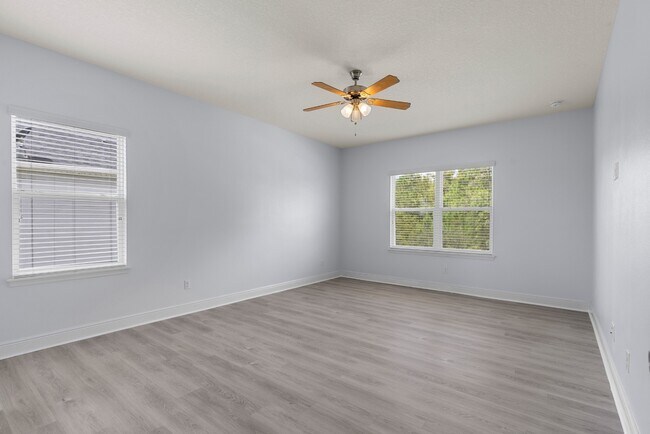 Building Photo - Spacious 6-Bedroom Home Near Lake Nona | 3-Car Garage + Tesla Charger