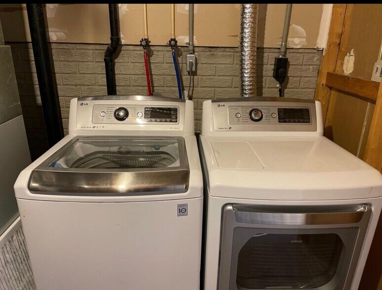 Full size washer and dryer included with the home. - 289 Preswicke Ml