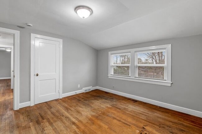 Building Photo - Brick home, Two Story, Hardwoods, DR, 2 Sun Rooms, FP, Carport!.