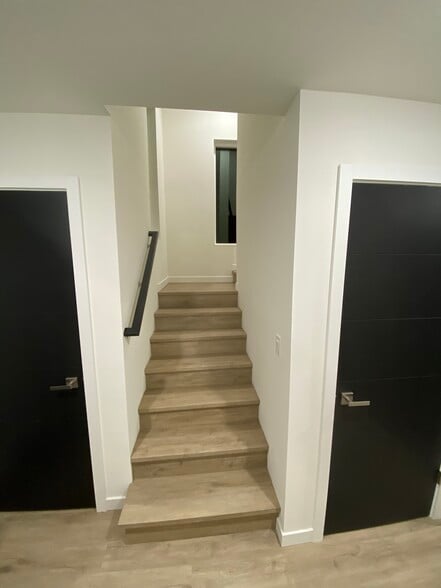 Entry way and stairs to upstairs. Coat closet on left and another storage closet on right - 2609 S Judkins St