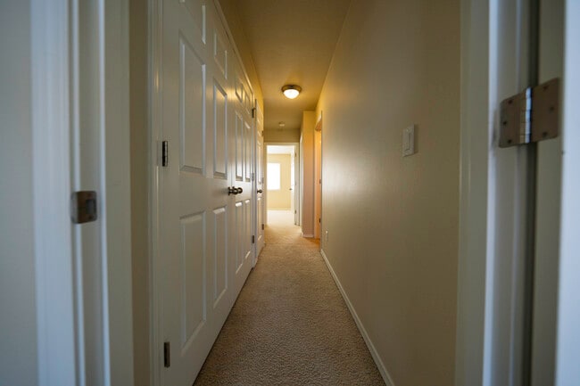 Third floor hallway, washer/dryer doors on left - 4828 SE Teakwood St