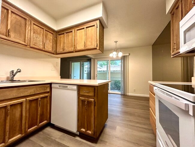 Building Photo - Beautiful Downstairs 2 Bedroom Condo Located In Gated Community Pool + Lake Access!