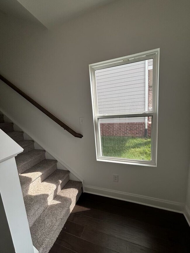 Building Photo - **BE THE LUCKY ONE TO LIVE IN THIS 2024-BUILT END-UNIT TOWNHOME IN A RESORT-STYLE COMMUNITY**