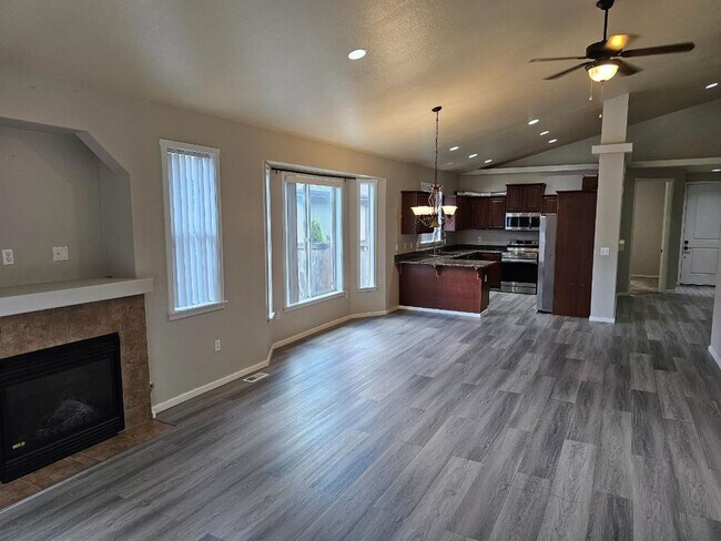 Building Photo - Spacious Tacoma Home with Gas Fireplace, 3-Car Garage & Covered Patio!