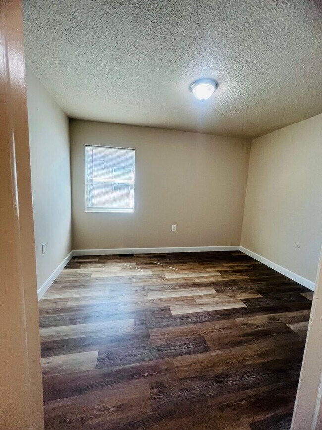 Building Photo - Freshly Painted 3 bed 1 bath with fenced front yard minutes from Fort Carson . $300.00 off the fi...