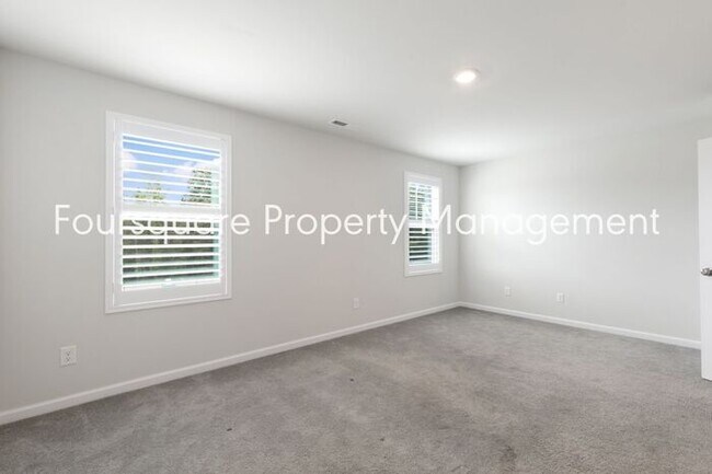 Building Photo - Stylish 3-Level Townhome with Bonus Suite, Deck & Garage – Near I-540 and Shopping